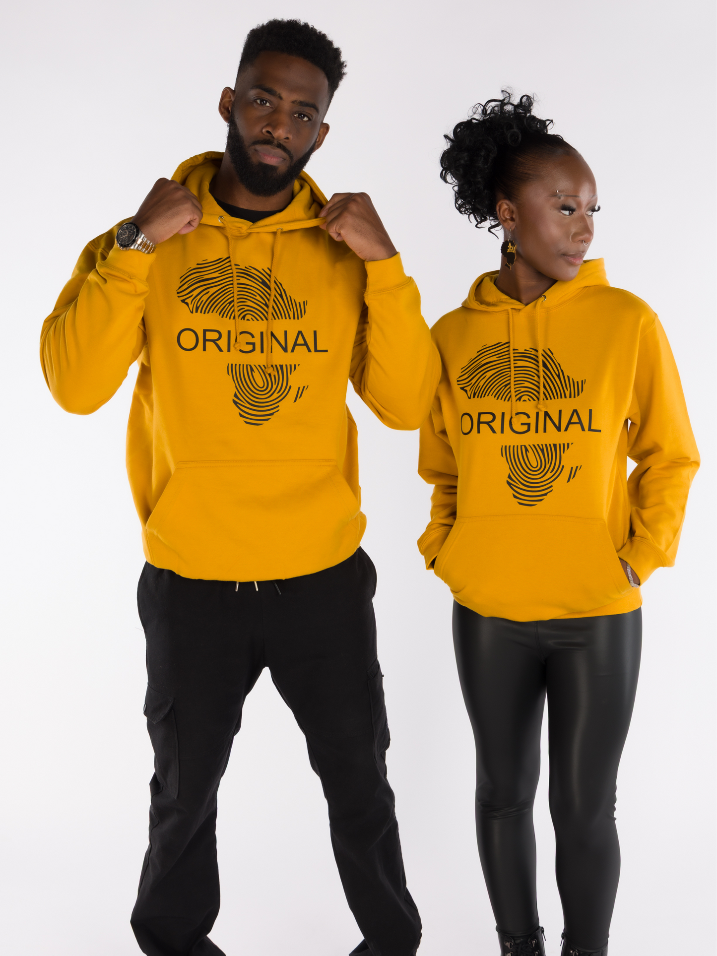 Matching couple’s mustard yellow hoodies with Africa fingerprint map and Original text on front. Unisex Afro Armour Afrocentric streetwear fashion.