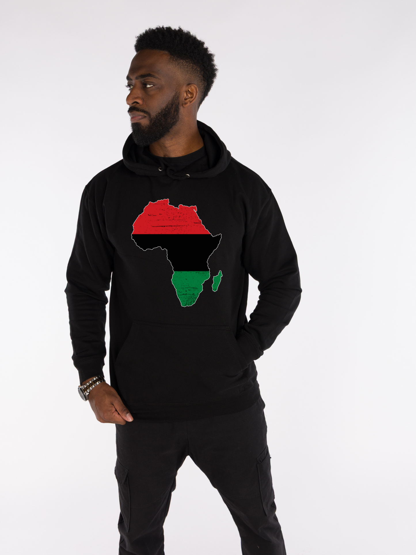 Man wearing black hoodie with Pan-African red, black, and green Africa map graphic, Afrocentric streetwear.