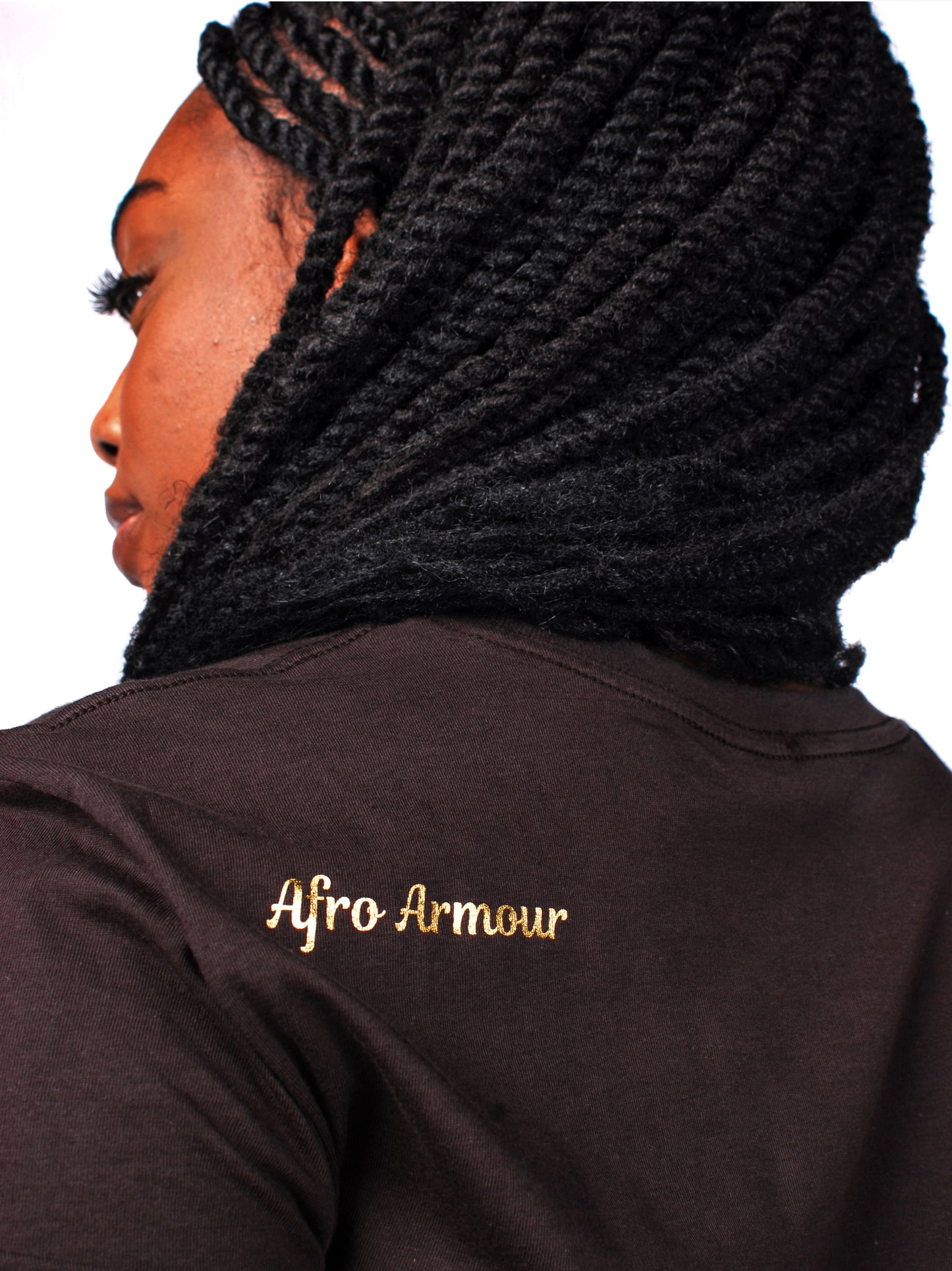 Close-up of women’s chocolate brown hoodie with gold Afro Armour logo on back. Premium Afrocentric streetwear.